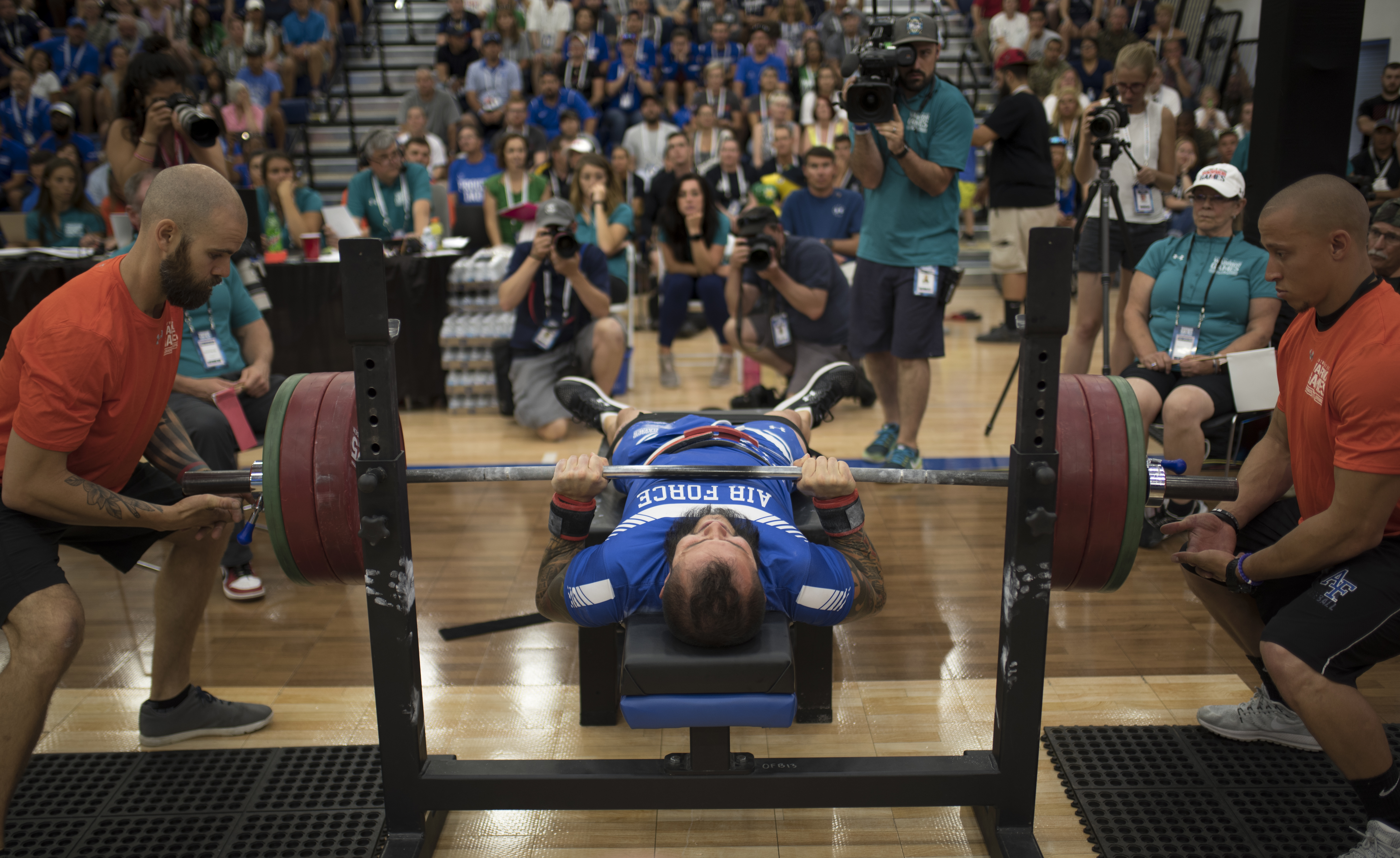 Powerlifting athlete competing on platform with loaded barbell